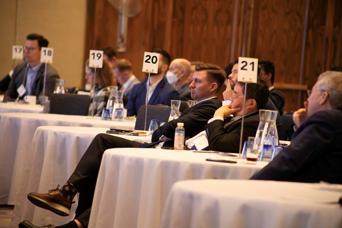 Audience members listening to panel 2