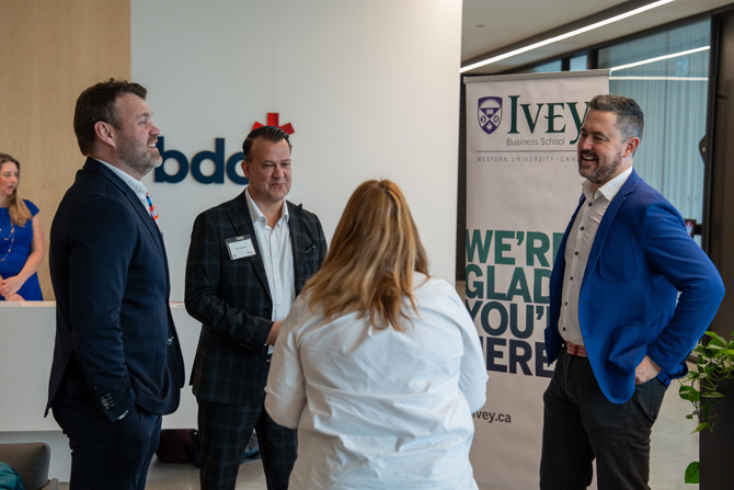 Attendees networking at the event