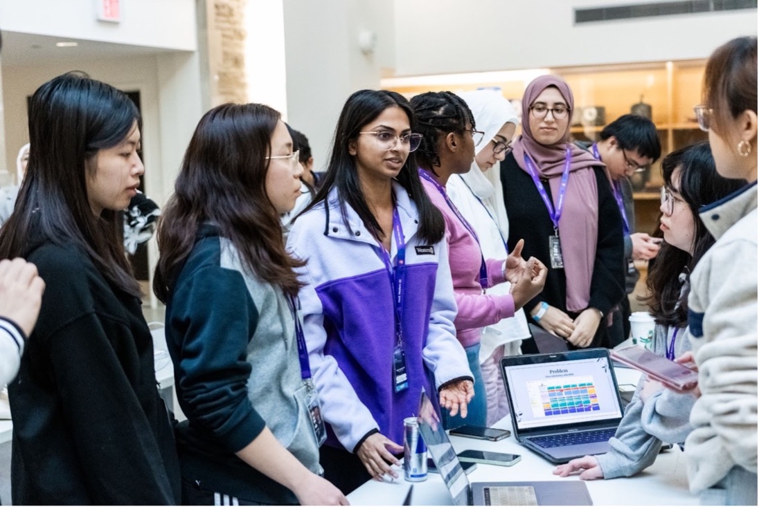 Hackathon team presenting their project at Hack Western 10