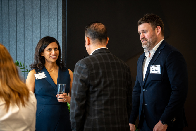 Attendees networking at the event