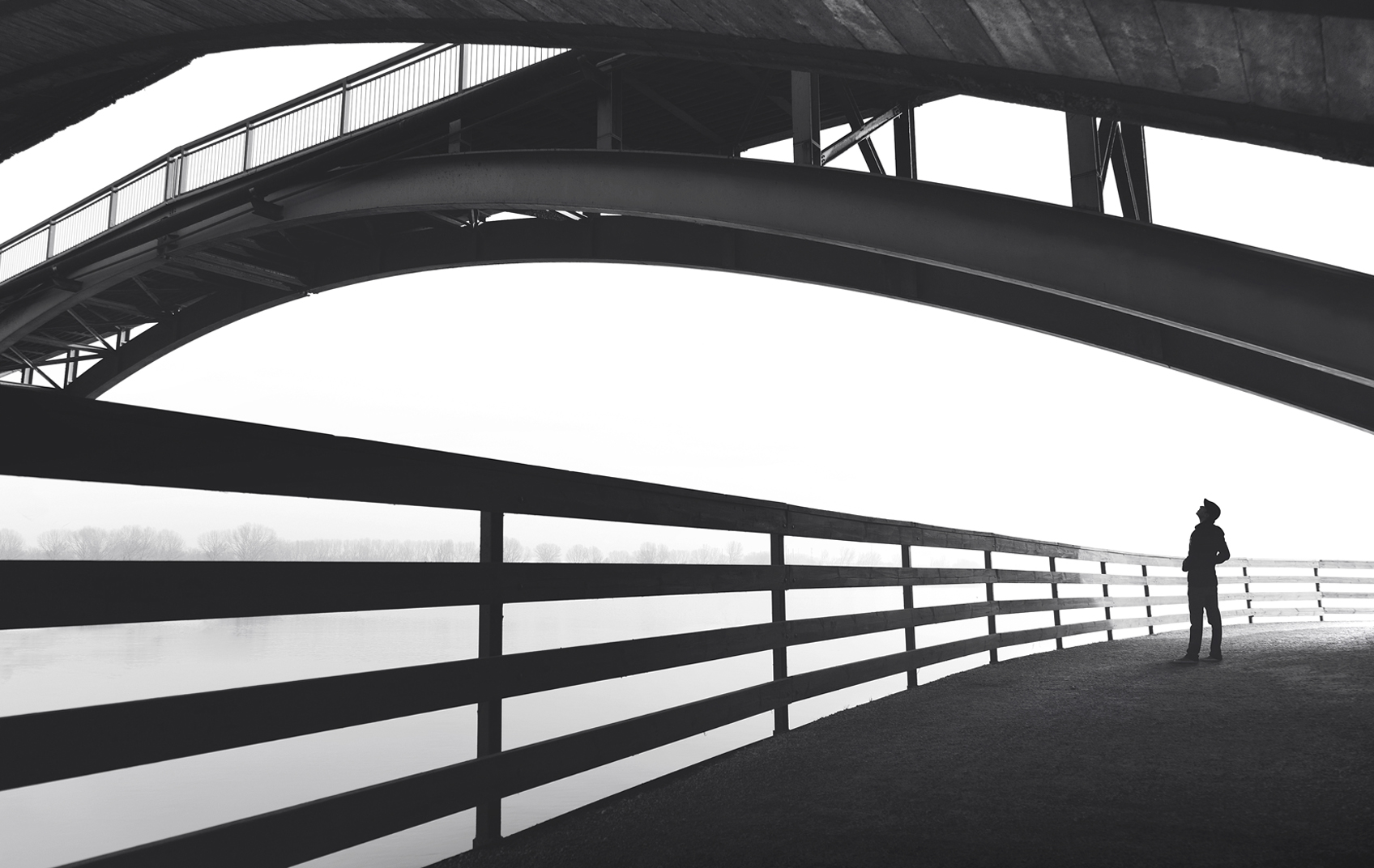 Tangerine Lecture - Man standing under bridge