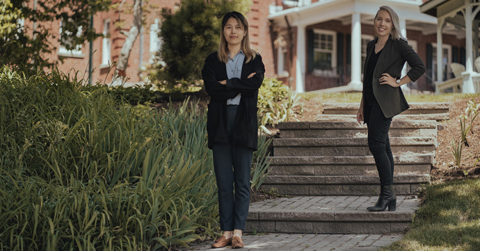 Baowen Zhang and Courtney Young in front of the Ivey Spencer Leadership Centre