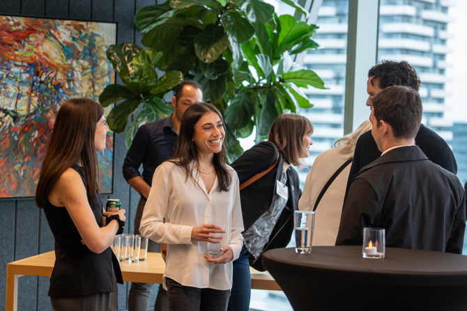 Attendees networking at the event