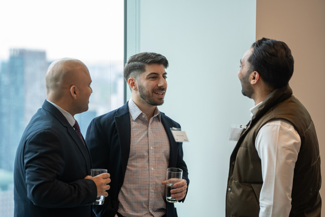 Attendees networking at the event