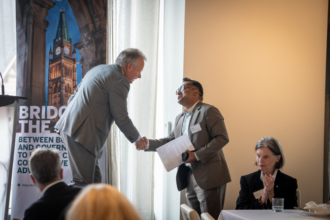 Stephen Poloz and Romel Mostafa