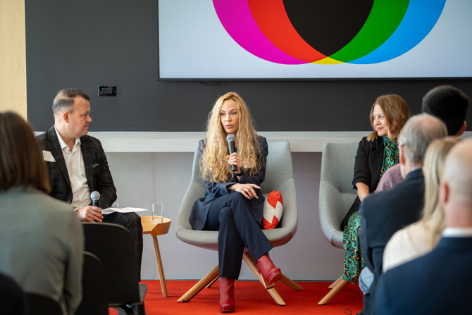 Teanne von der Porten, MBA ’05 answering questions from the moderator and audience