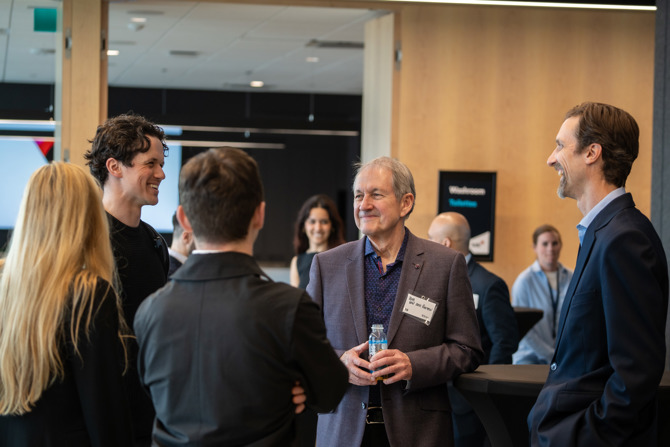 Attendees networking at the event