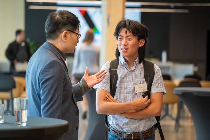 Attendees networking at the event