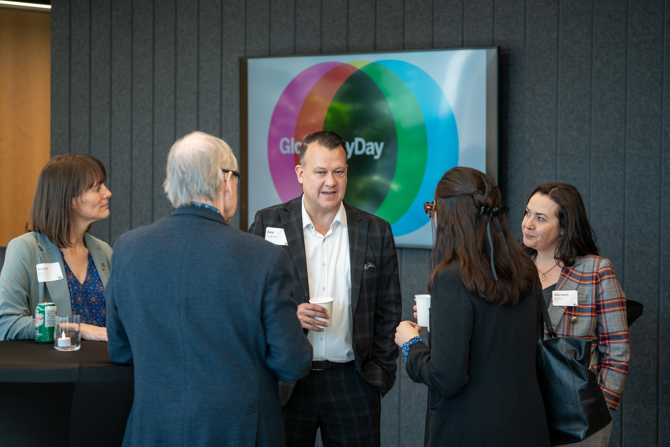 Attendees networking at the event