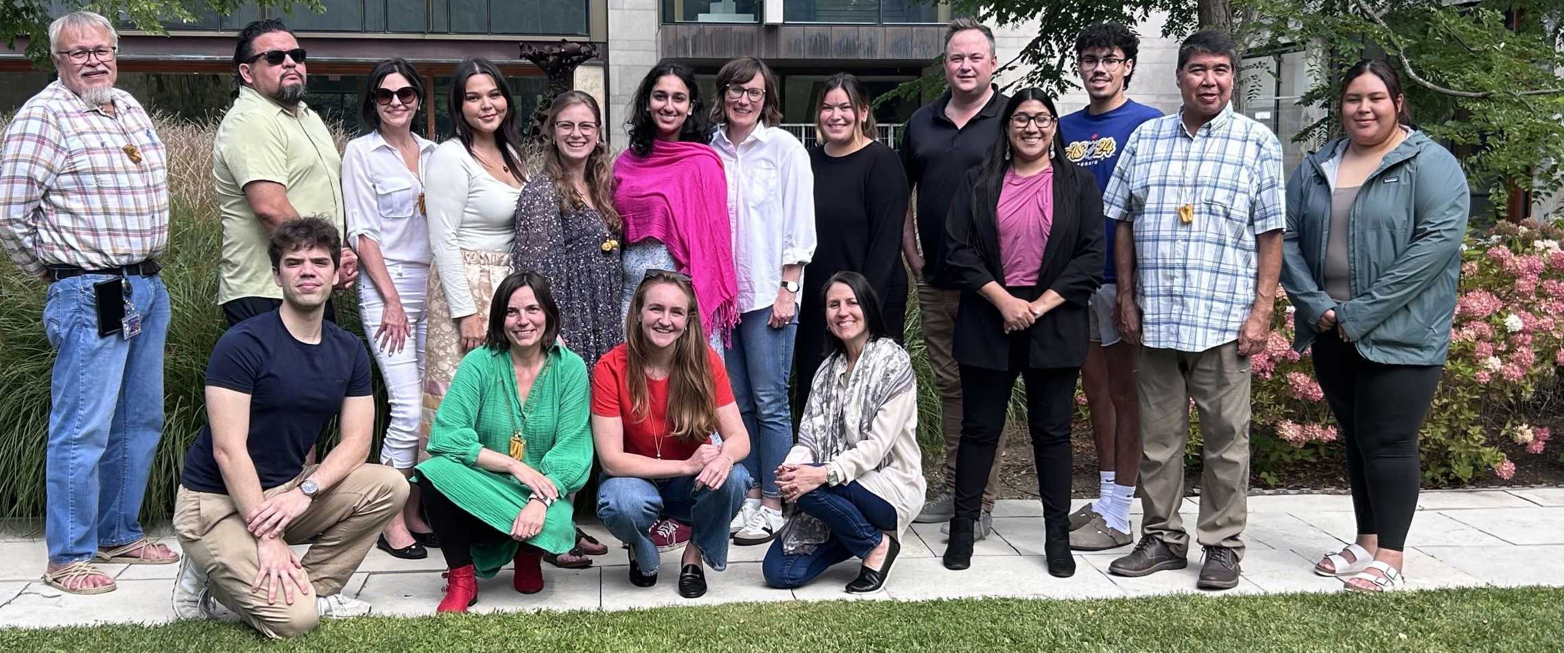 The participants in the first Ivey Reconciling Business School Workshop stood in a line in the Quadrangle of the Ivey Building