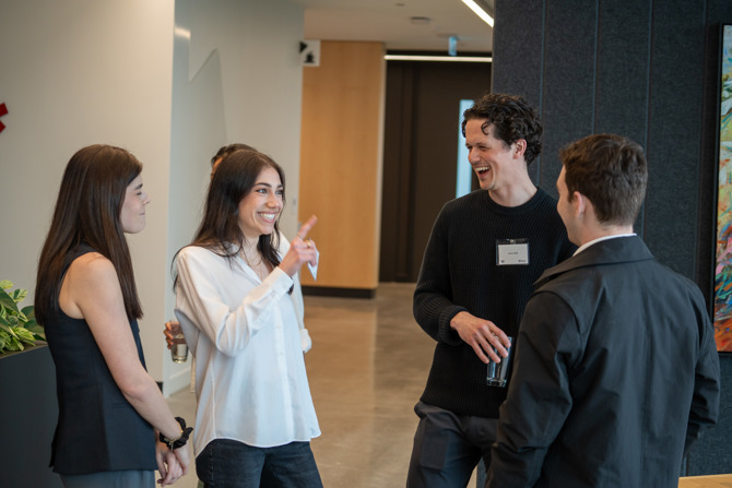 Attendees networking at the event