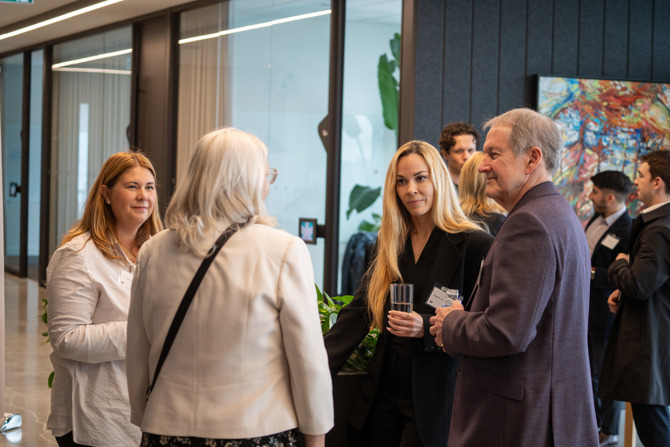 Attendees networking at the event