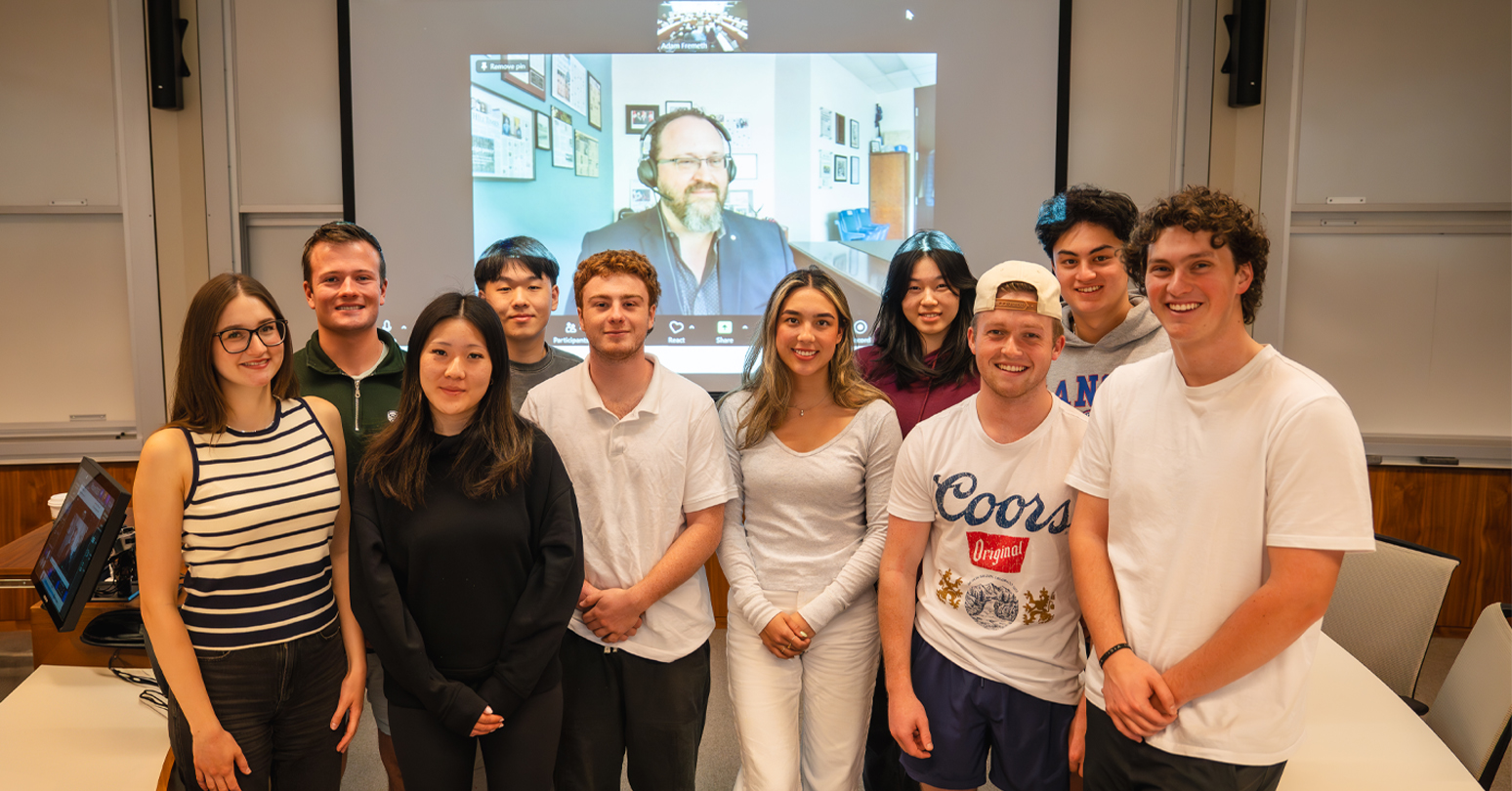 Flavio Volpe (on screen) behind HBA2 students in the Business Strategy in a Political World course